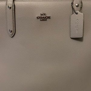 Coach bag - gray and big enough to fit your laptop.